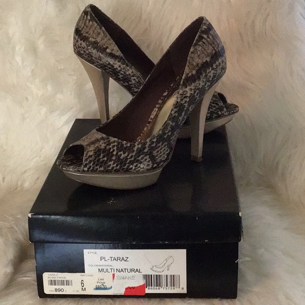 Peep toe leather heels 4.25 inches. Worn once, no visible marks.